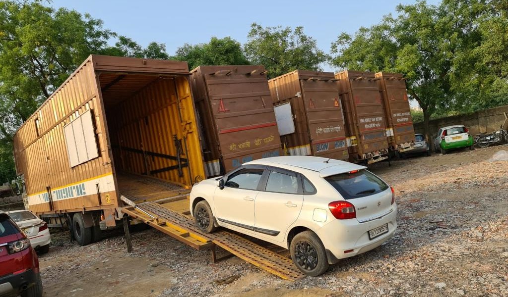 Covered car carrier for car and bike transport from Mumbai